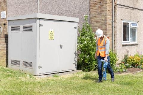 Man walking and using the The RD8200SG Survey Grade Locator